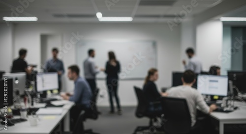 Deliberately blurred vision of a contemporary office setting filled with activity