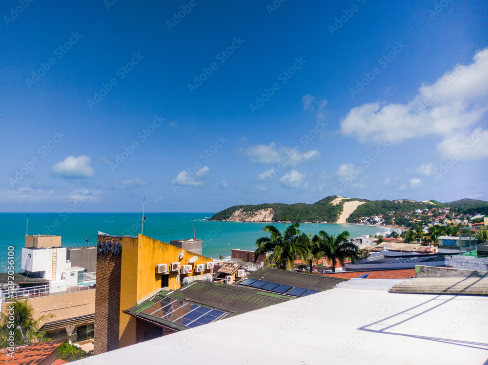 Obraz premium Morro do Careca Beach in Natal, Brazil, a paradisiacal vacation destination.