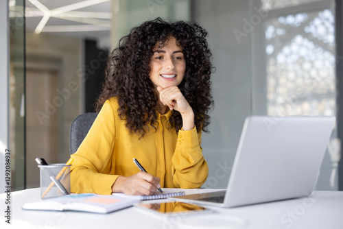 Wallpaper Mural Businesswoman filling out tax forms online. Woman smiling and happy with paperwork inside office, working with contracts, documents and reports. Torontodigital.ca