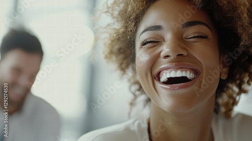 Happy professionals laughing during casual meeting.