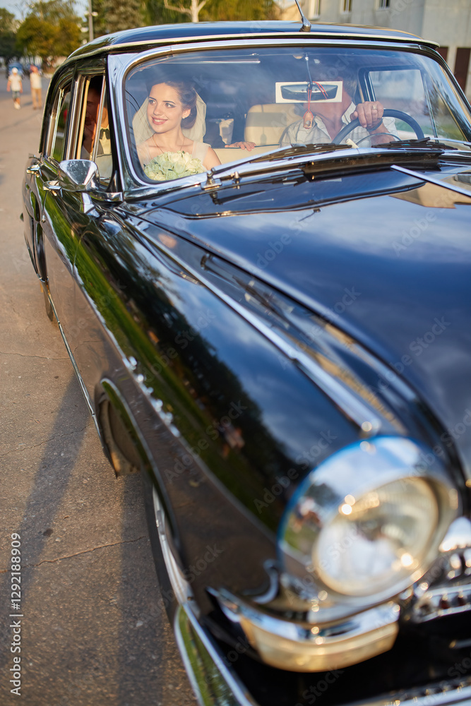Fototapeta premium Bride in a Classic Car