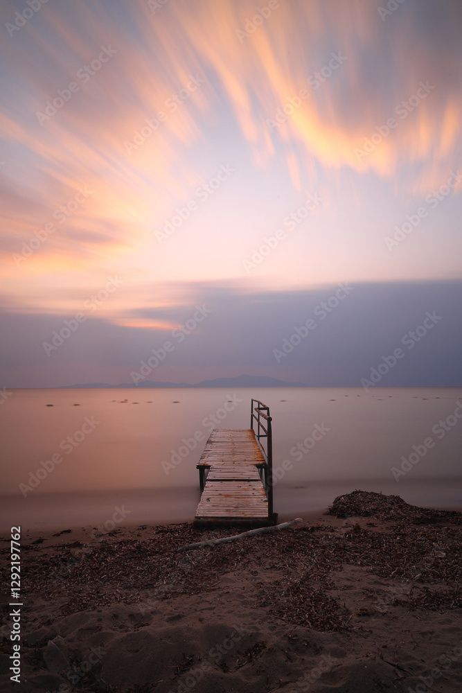 Old abandoned wooden fishing pier on the sea in the countryside