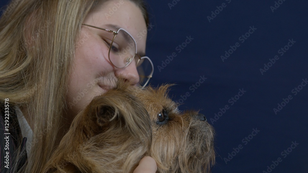 A woman embraces her dog, expressing affection and warmth in a heartfelt moment of connection and companionship. A woman embraces her dog, expressing affection and warmth in a heartfelt moment of connection and companionship.
