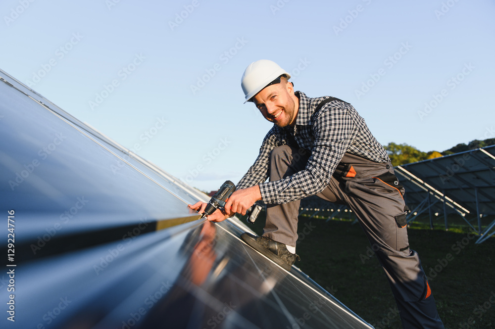 Man installer installing photovoltaic solar moduls. Concept of alternative and renewable energy Man installer installing photovoltaic solar moduls. Concept of alternative and renewable energy