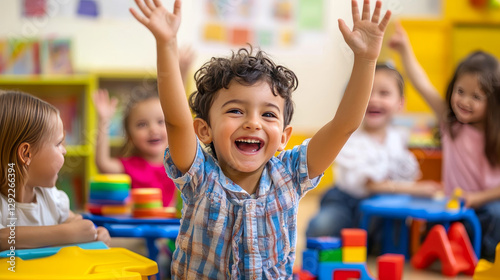 Children playing in kindergarten. Vector cartoon illustration of happy boy and girl having fun at nursery school, playroom with wooden furniture, pictures, books and colorful toys, early education