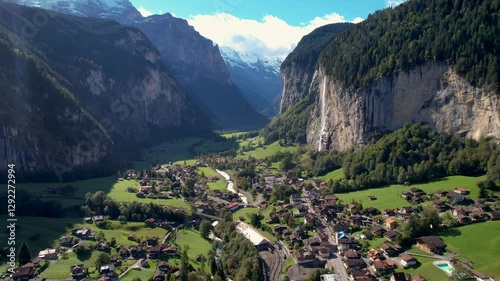 Beautiful aerial footage of Lauterbrunnen, a Swiss Alps valley with stunning cliffs, Staubbach and Trümmelbach Falls. A cable car from Stechelberg leads to Schilthorn, offering breathtaking views. photo