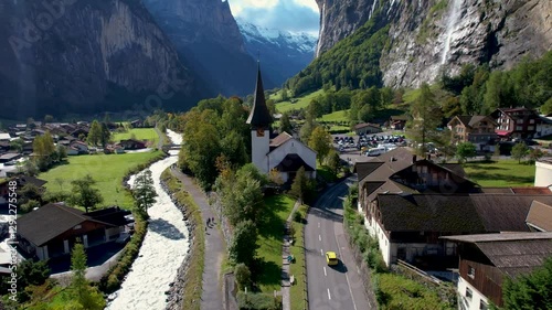 Beautiful aerial footage of Lauterbrunnen, a Swiss Alps valley with stunning cliffs, Staubbach and Trümmelbach Falls. A cable car from Stechelberg leads to Schilthorn, offering breathtaking views.