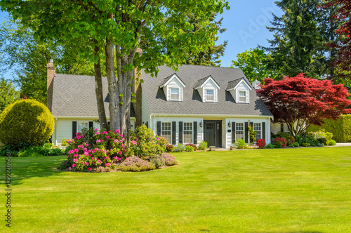 Two story luxury house with beautiful summer  landscape in Vancouver, Canada, North America. Day time on June 2024.