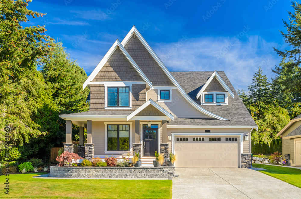Fototapeta premium Two story luxury house with beautiful summer landscape in Vancouver, Canada, North America. Day time on June 2024.