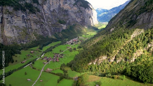 Beautiful aerial footage of Lauterbrunnen, a Swiss Alps valley with stunning cliffs, Staubbach and Trümmelbach Falls. A cable car from Stechelberg leads to Schilthorn, offering breathtaking views.