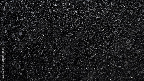 Dark surface of small pebbles creating a uniform black texture
