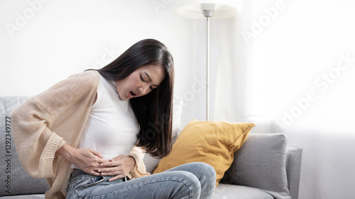 Wallpaper Mural Attractive woman, menstrual cramps, gastritis, intestinal diseases, digestive system diseases, body aches, concept of physical deterioration Torontodigital.ca