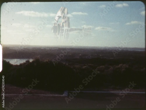 1960's Futuristic Space Ship Floating on Horizon