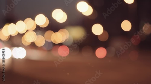 Bokeh Lights Of City Traffic At Night, Featuring Blurred Headlights And Taillights Creating A Colorful Urban Scene, Capturing The Essence Of Nocturnal City Life.