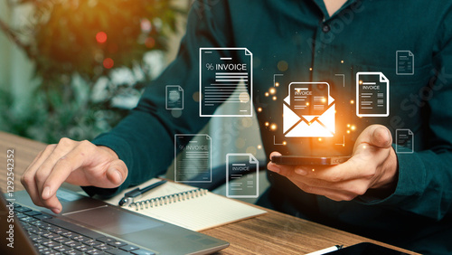 E-Invoice and Digital billing concept, Businessman using laptop to manage electronic statements on virtual screen. E-tax, Digital receipt, Online invoice processing and tax accounting solutions.