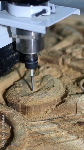 carving a stylized teak collage on a CNC machine with a 4 mm diameter cutter, a ship figurine, marine animals, the final stage