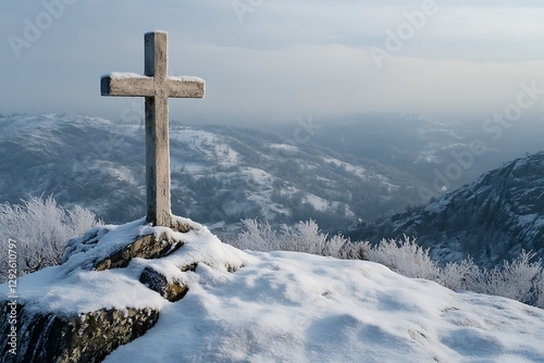 Snowy mountaintop cross, winter landscape