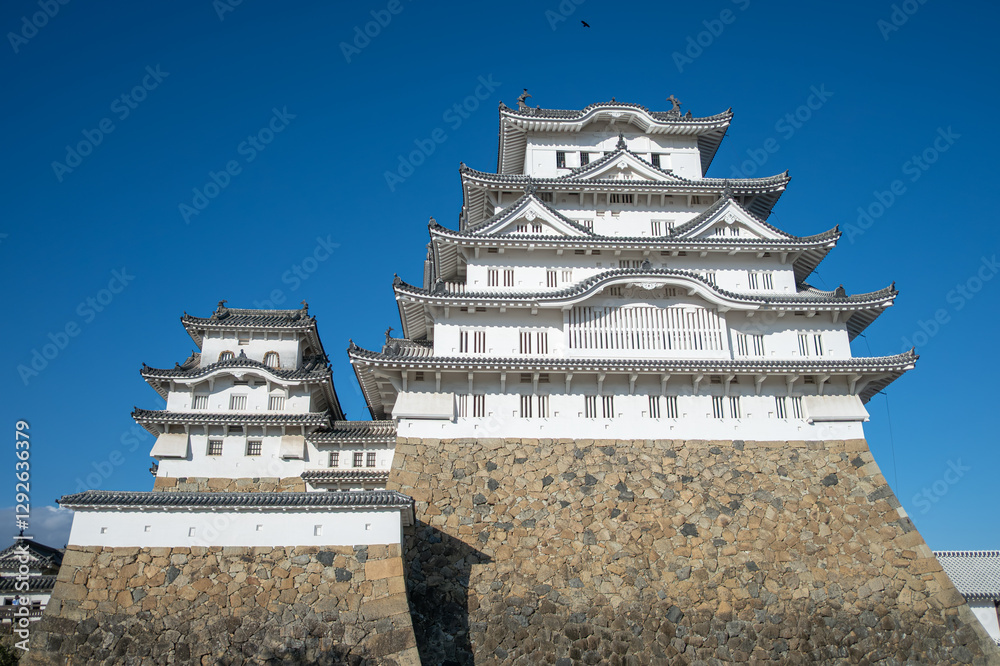 Himeji castle, Majestic Japanese castle against a clear blue sky at Himeji, Japan Himeji castle, Majestic Japanese castle against a clear blue sky at Himeji, Japan