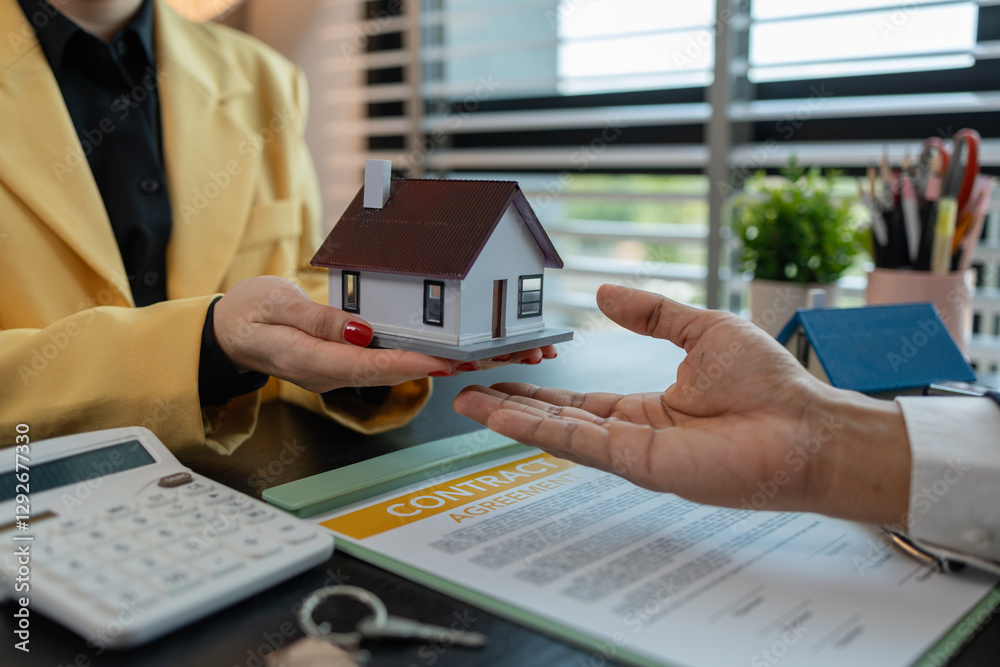 © kamiphotos - after signing a contract to purchase or lease a property, the salesperson will then hand over the keys so that the buyer or tenant can enter the living space