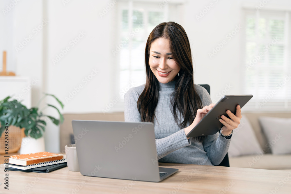 Young confident woman using laptop at home office. Work from home Young confident woman using laptop at home office. Work from home