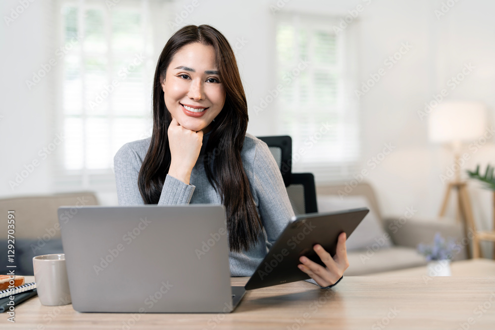 Young confident woman using laptop at home office. Work from home Young confident woman using laptop at home office. Work from home