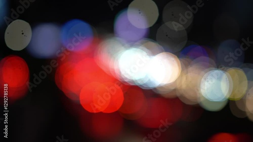 Car Front and Rear Lights in Night Traffic with Defocused Lights Bokeh Mode Footage