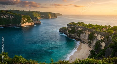 Scenic Coastal Cliff with Blue Sea and Sandy Beach at Sunset