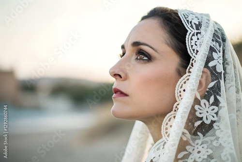 Minimalistic photo of a woman in a Spanish mantilla, extreme close-up emphasizing the delicate lace details and her intense, expressive eyes, softly blurred background.