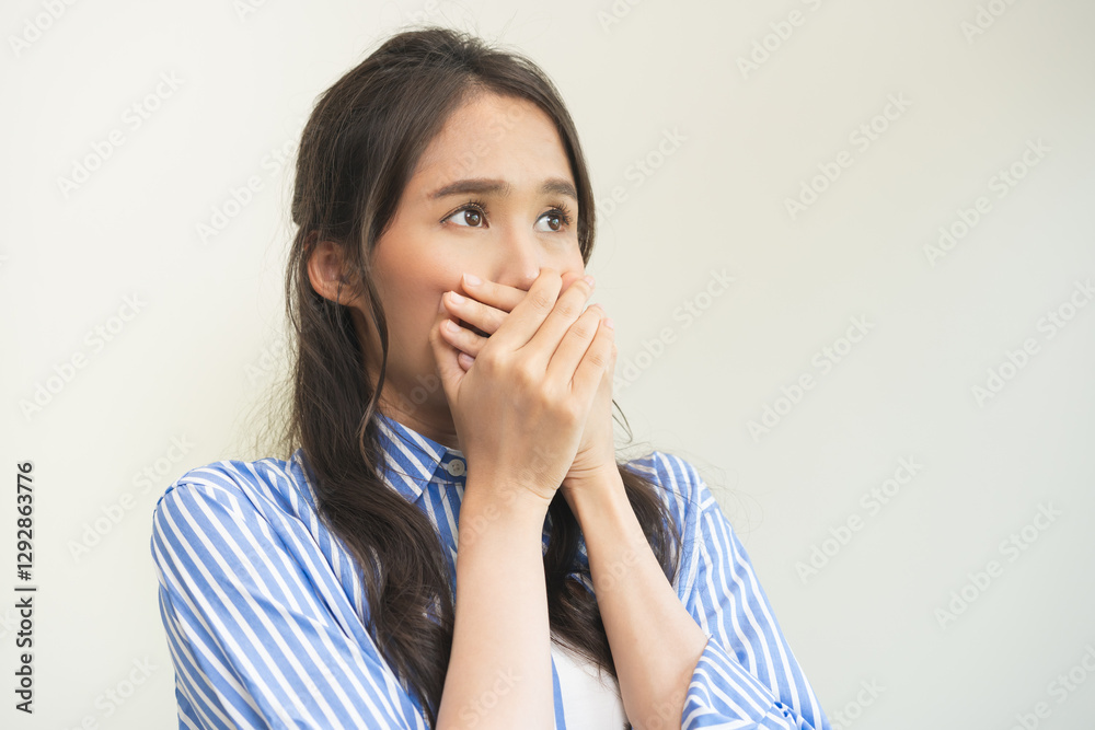 Portrait of pretty brunette hair, disgust smell bad breath strong asian young woman shocked covering, close her mouth with hand, expression face disgusting, dislike odor. Isolated on white background. Portrait of pretty brunette hair, disgust smell bad breath strong asian young woman shocked covering, close her mouth with hand, expression face disgusting, dislike odor. Isolated on white background.