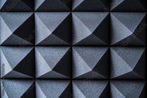 Detailed view of gray sound absorbing foam panel Geometric texture for soundproofing photo