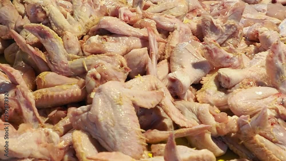 A Pile of Raw Chicken Wings Ready for Cooking A Pile of Raw Chicken Wings Ready for Cooking