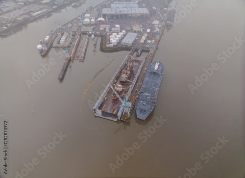 A large ship is docked at a port
