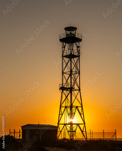 Point Gantheaume lighthouse at sunset, complete with Osprey and nest. Broome Western Australia. photo