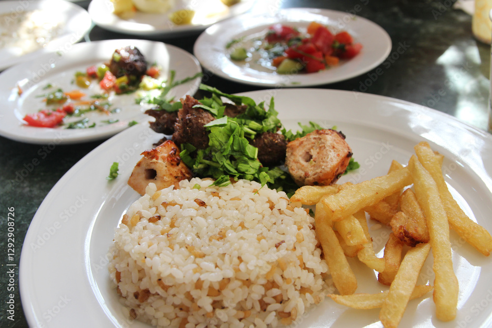 Egyptian rice with french fries, grilled chicken and beef in a Luxor restaurant, Egypt Egyptian rice with french fries, grilled chicken and beef in a Luxor restaurant, Egypt