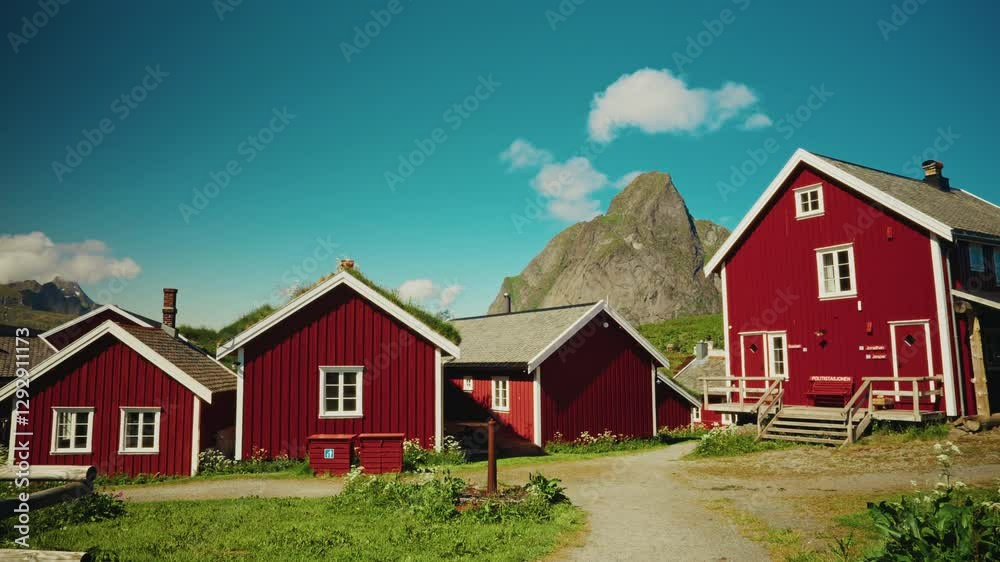 Panoramic view of the red wooden fishermen cabins in the Lofoten islands, Norway. View of the picturesque landscape in the background Panoramic view of the red wooden fishermen cabins in the Lofoten islands, Norway. View of the picturesque landscape in the background