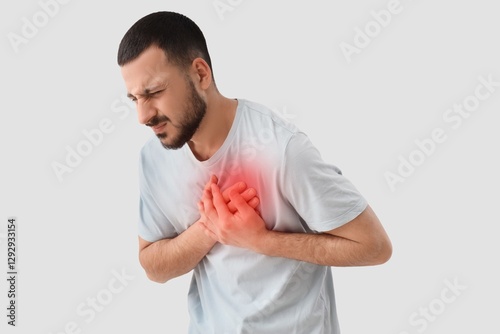 Young man having heart atta...