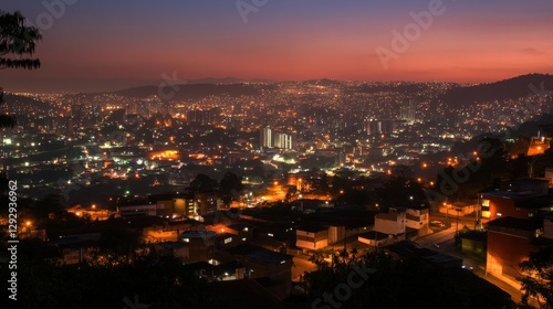 Cityscape twilight panoramic view, hills, sunset, urban sprawl, night lights, travel