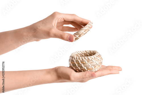 Female hands holding wicker...