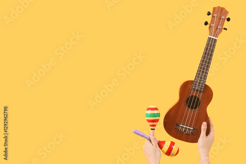 Female hands holding ukulel...