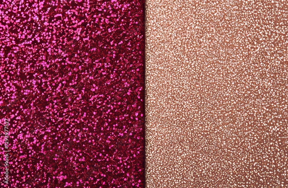 Fototapeta premium The delicate pastel colors of a light pink background are elevated by the presence of scattered golden metal glitter, resulting in a minimalistic, festive, and glamorous aesthetic