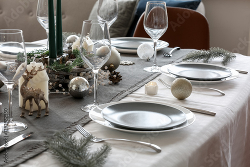 Dining table served for Christmas celebration, closeup