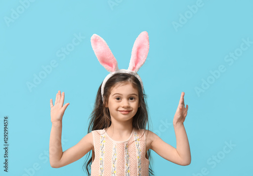 Cute little girl in bunny e...