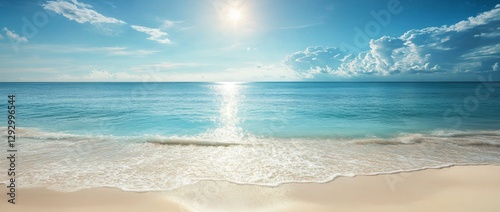 The Mediterranean beach boasts a breathtaking panoramic view of waves crashing against the shore under a sunny blue sky with clouds