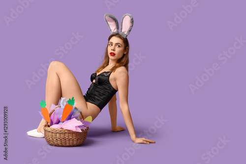 Sexy young woman in bunny e...