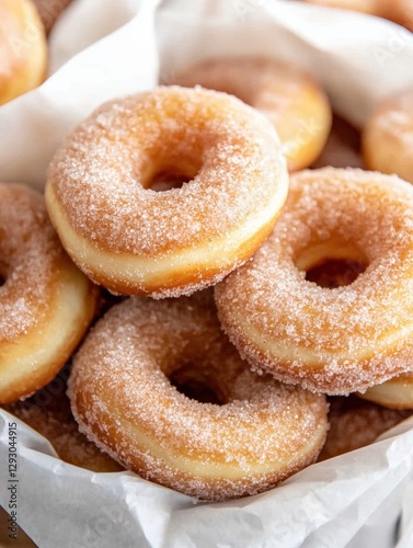 Colorful basket overflowing with sugared donuts glazed to perfection and ready to delight sweet tooth enthusiasts