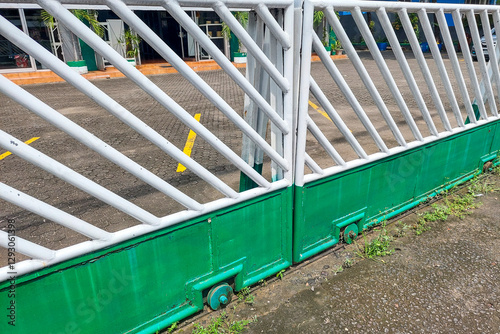 Newly painted white and blue iron fence