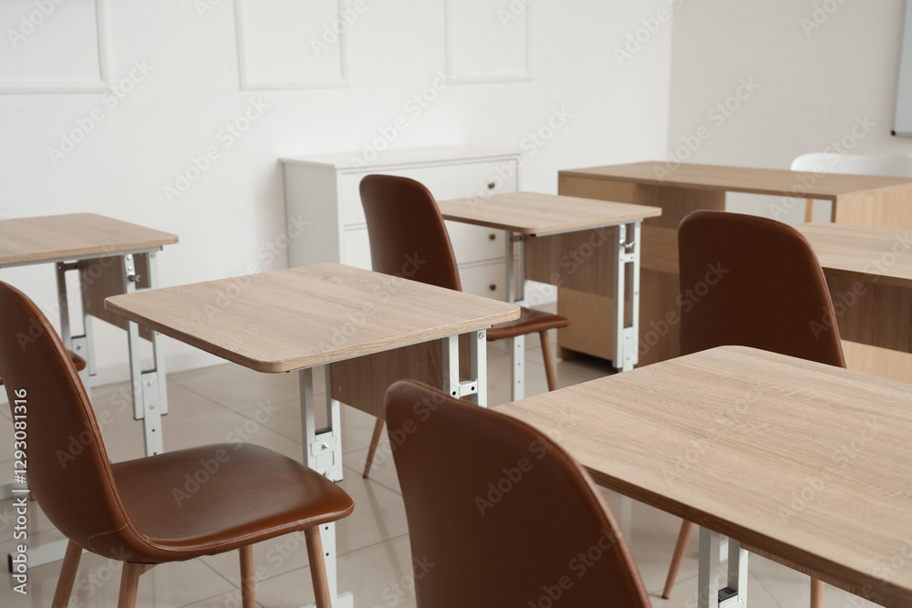 Interior of empty classroom with school desks Interior of empty classroom with school desks