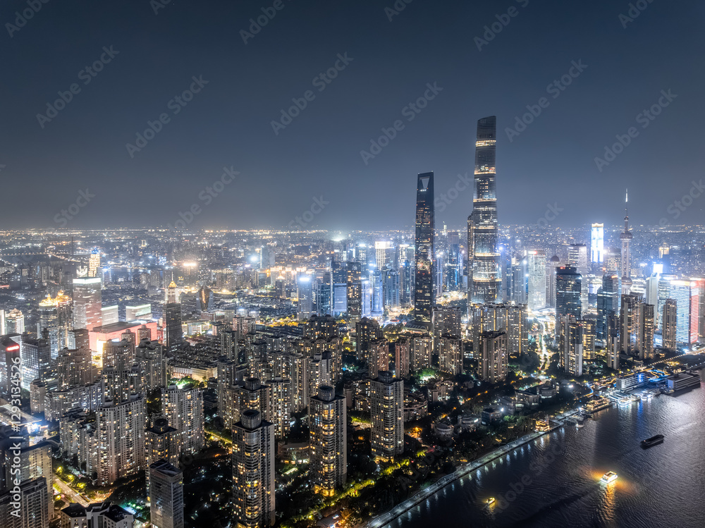 Fototapeta premium Aerial view of illuminated Shanghai city skyline at night