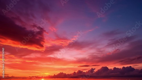 Bright golden yellow clouds dazzle the sky at sunrise. Bright red-orange sky, beautiful beyond imagination. drone shooting stunning sky full of colorful cloud. abstract nature background.