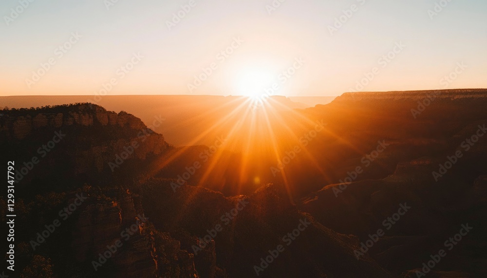 Fototapeta premium Sunrise over vast canyon with glowing horizon